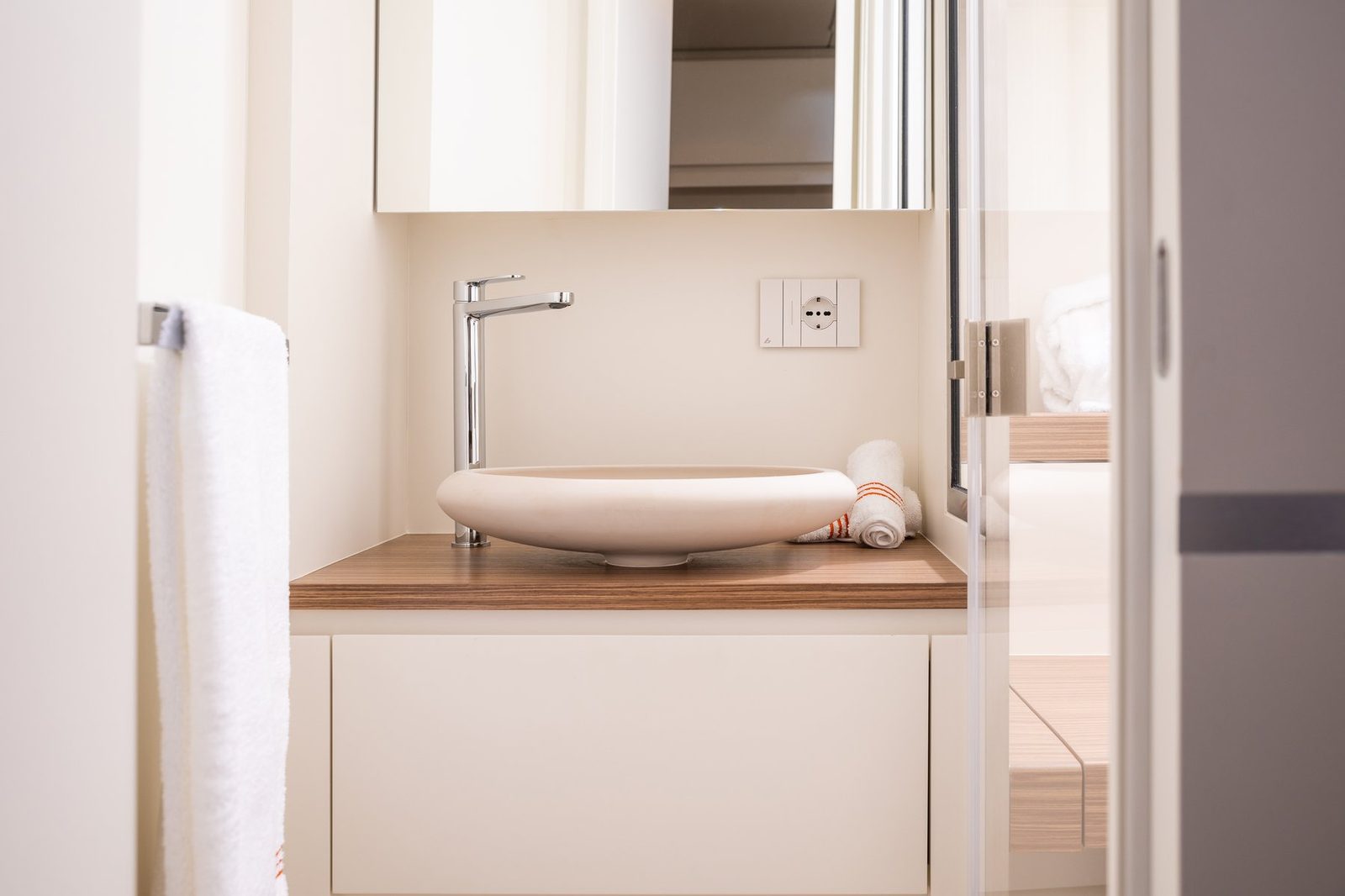 Sculpted basin with chrome mixer tap