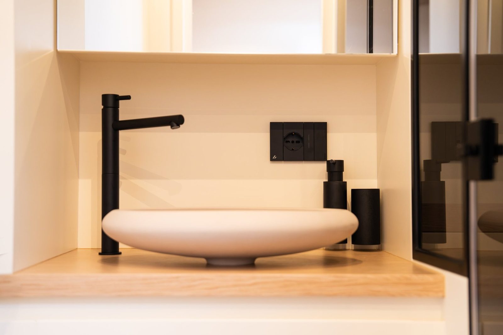 Head with basin and mirrored cabinet